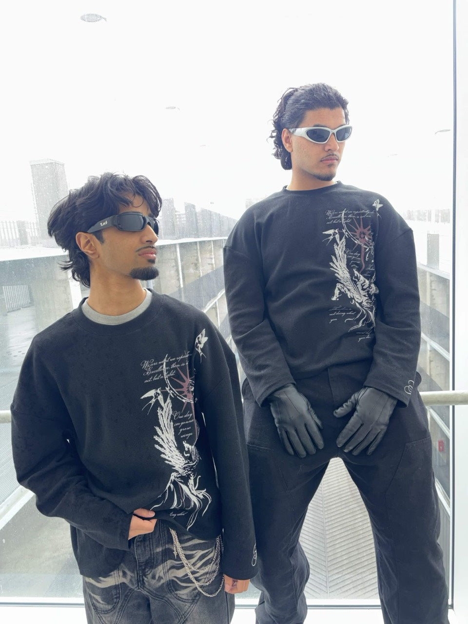 Two models styling the AURELIUS Fallen Thermal